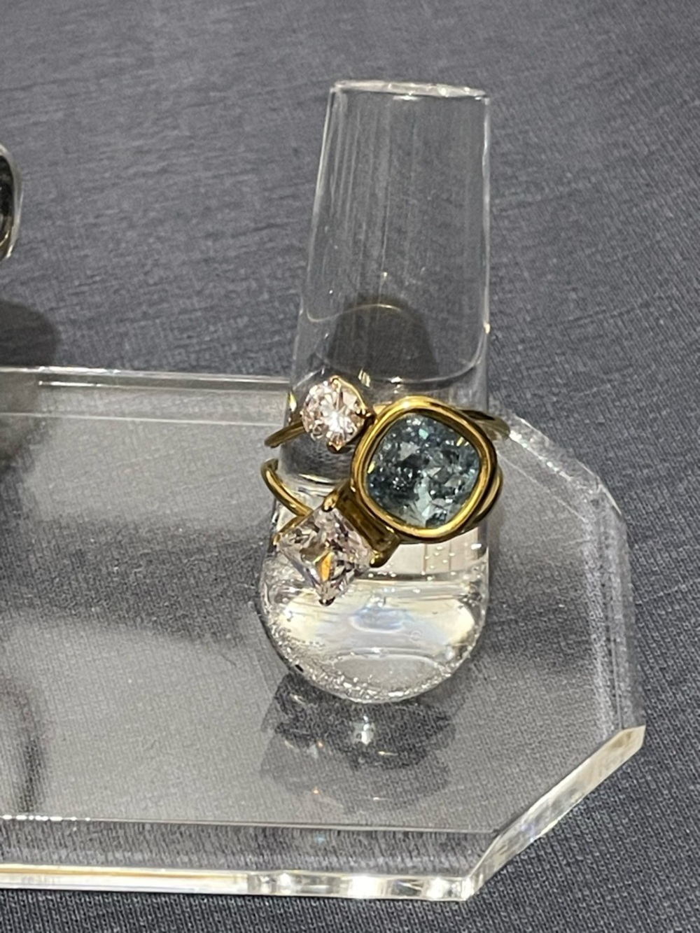 Gold Ring with Blue Oval Gem and Clear Cubic Stones